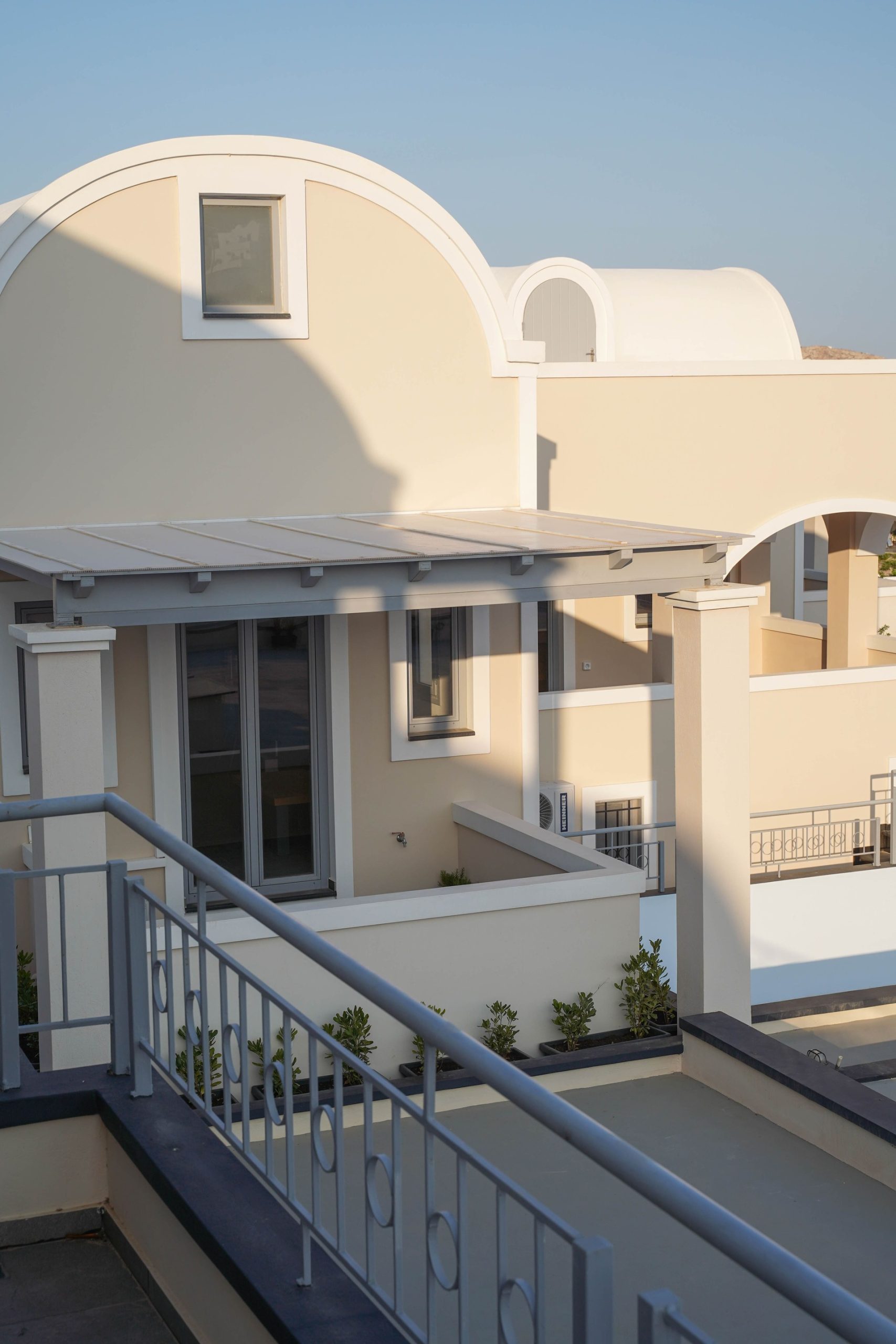 Santorini loft suite interior with caldera view – Noverian Caldera Suites